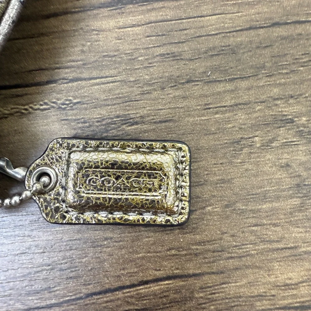 Coach Gold Clutch Wristlet with Elegant Design